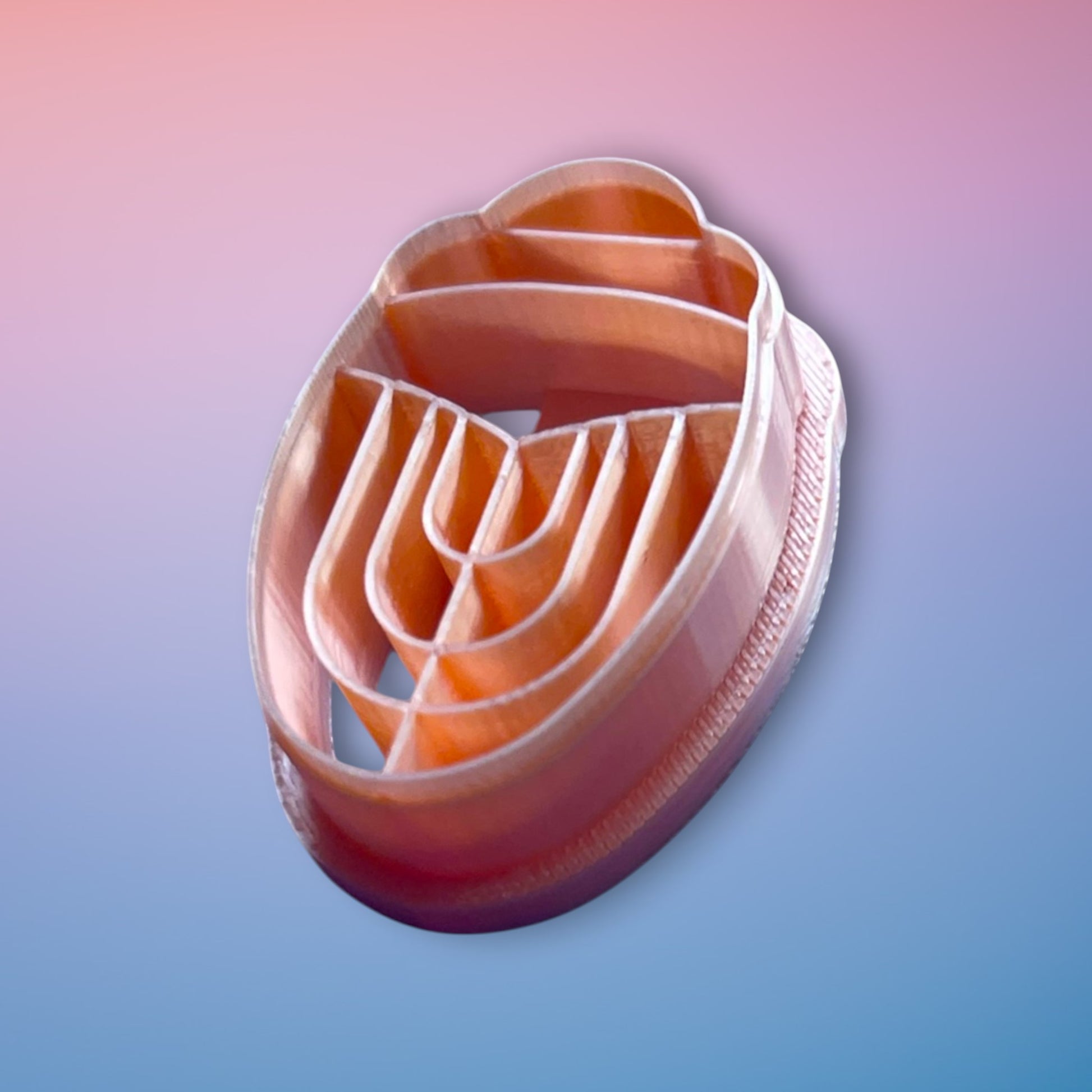 Art Deco Scarab polymer clay cutter with geometric embossed detailing on white background.