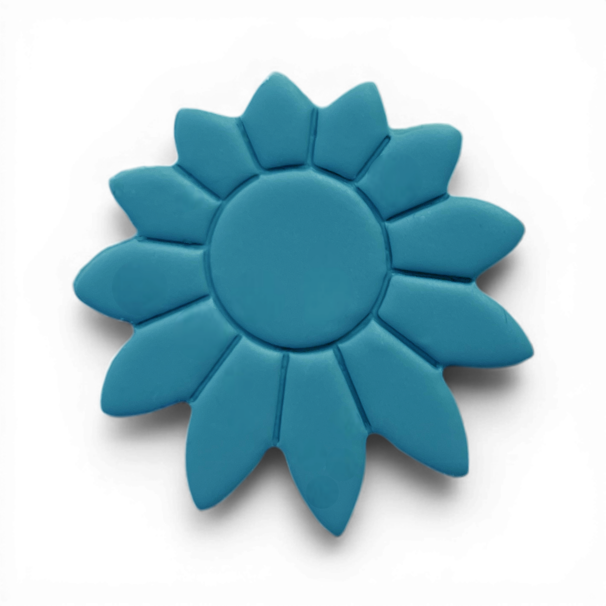 Boho Daisy polymer clay floral shape in soft blue with rounded center and elongated petals on white background.
