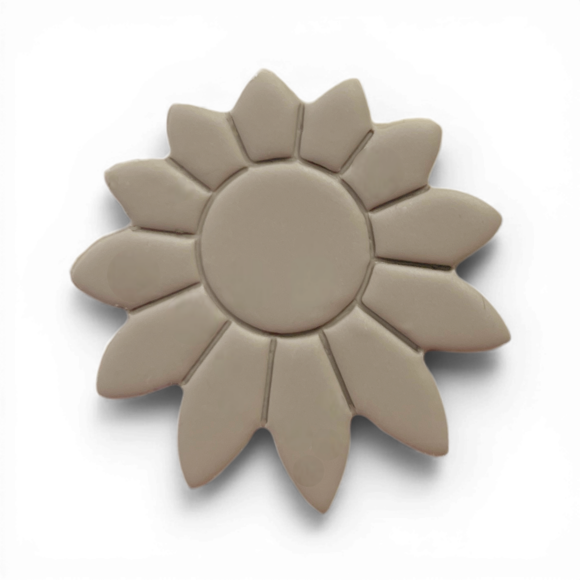 Boho Daisy polymer clay floral shape in warm taupe with soft sunburst detailing on white background.