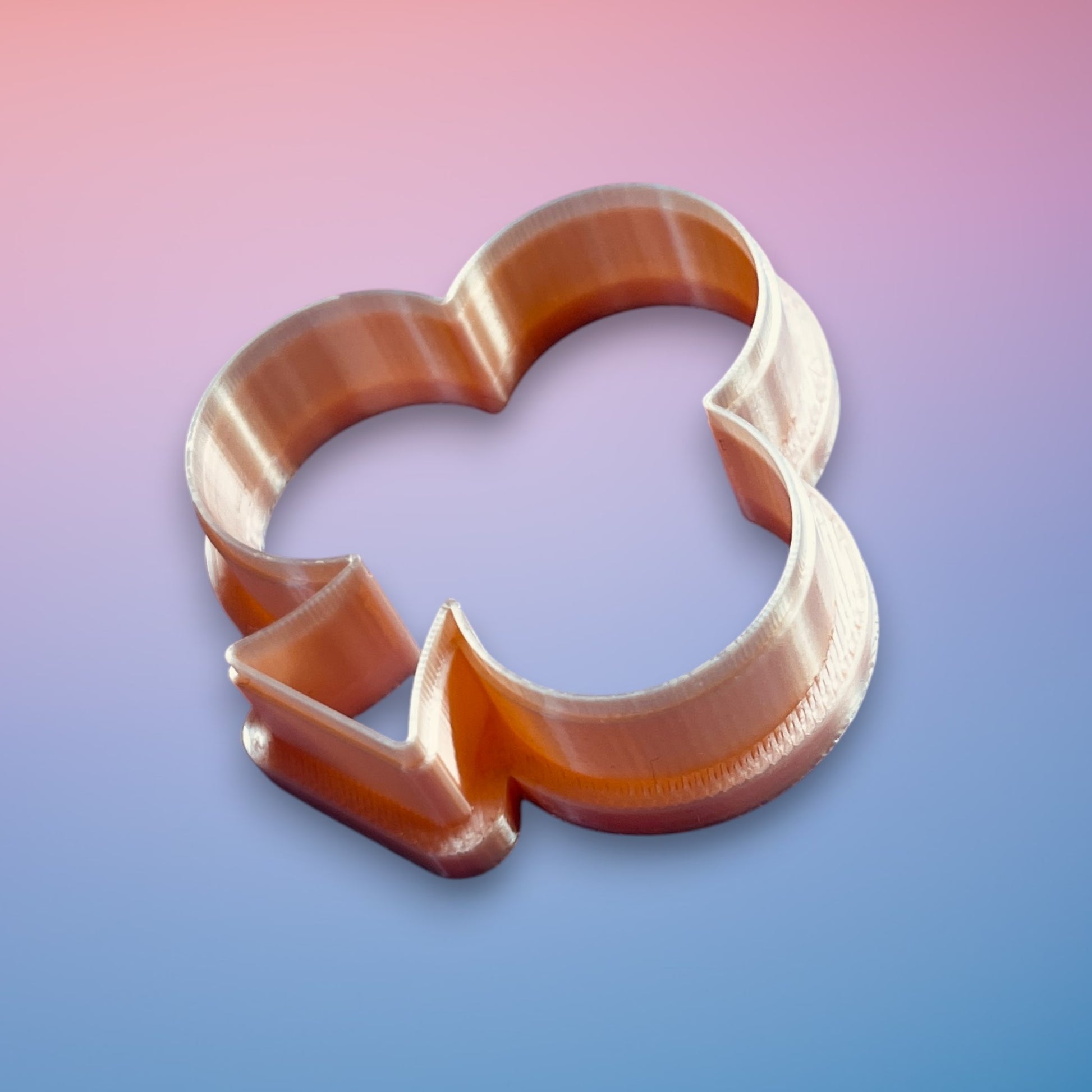 Club Emblem polymer clay cutter with smooth rounded graphic silhouette on white background.