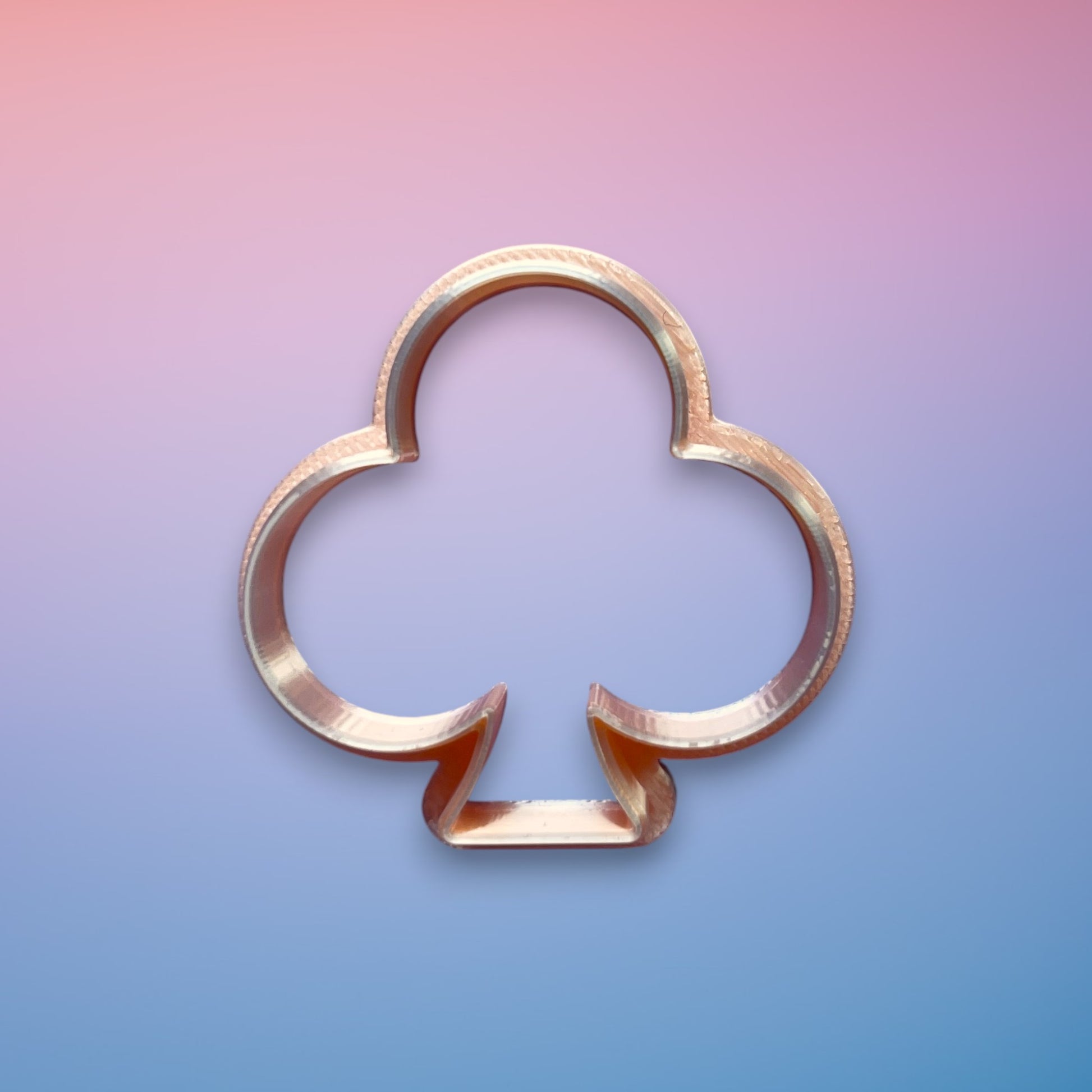 Club Emblem polymer clay cutter with smooth rounded graphic silhouette on white background.