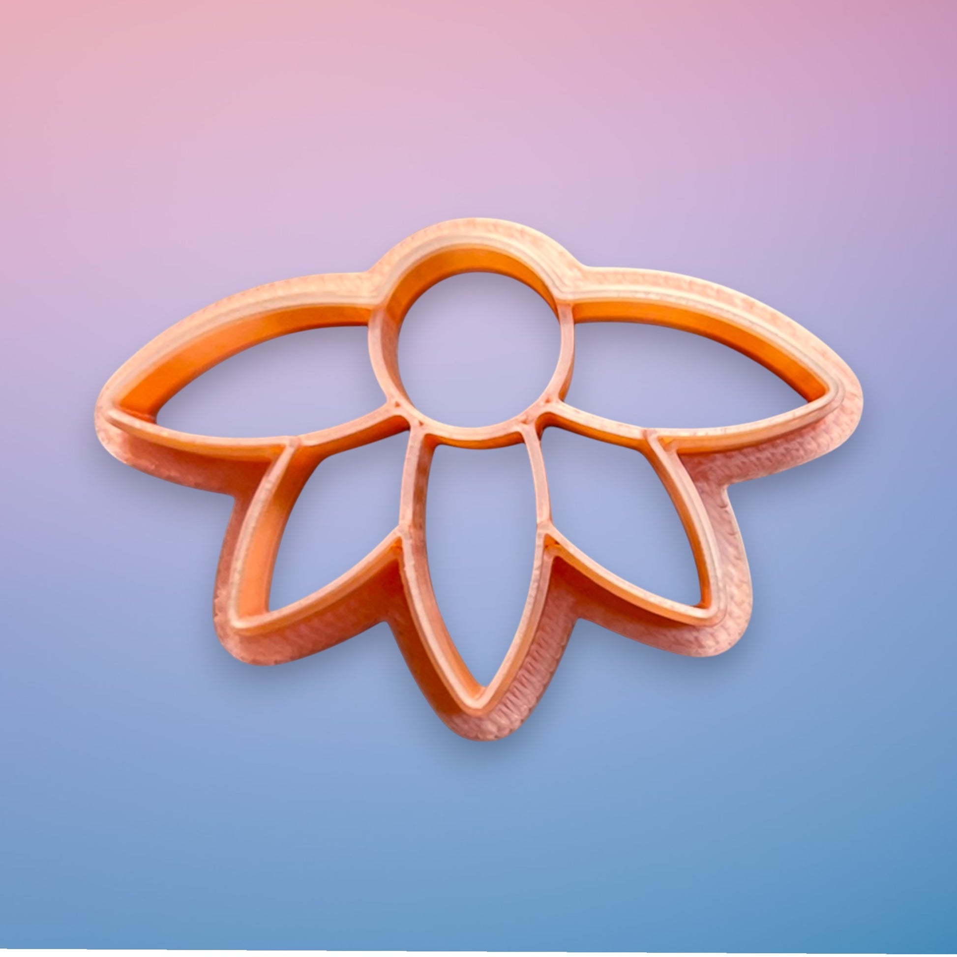 Daisy Dawn polymer clay cutter with flowing tapered petals and rounded center on white background.