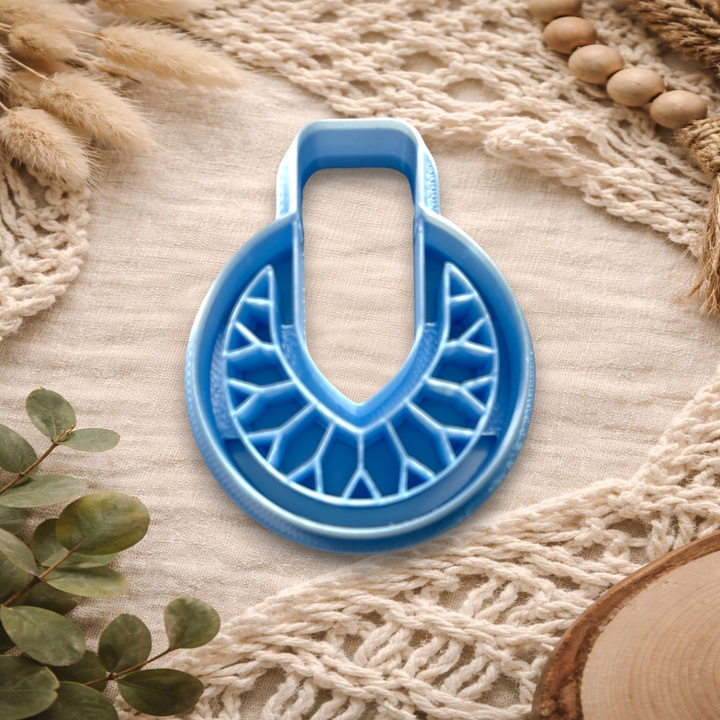 Deco Crest polymer clay cutter with Art Deco fan design
