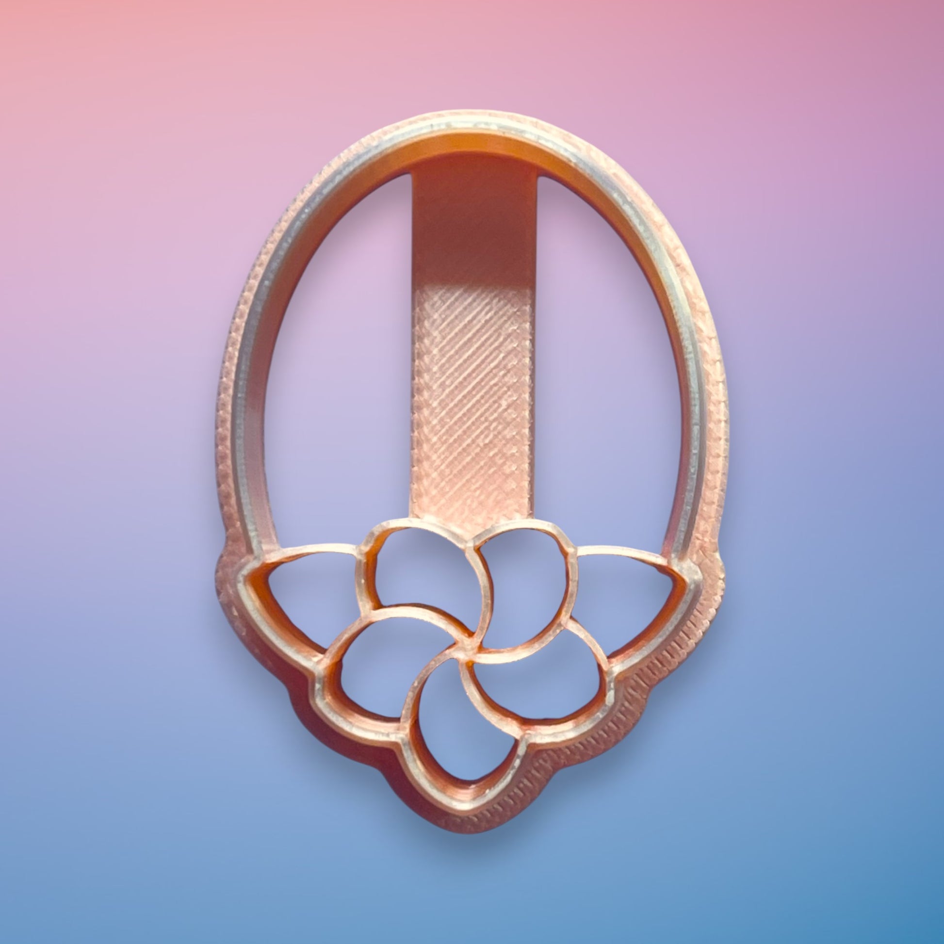 Deco Petal Drop polymer clay cutter with elongated Art Deco petal silhouette on white background.