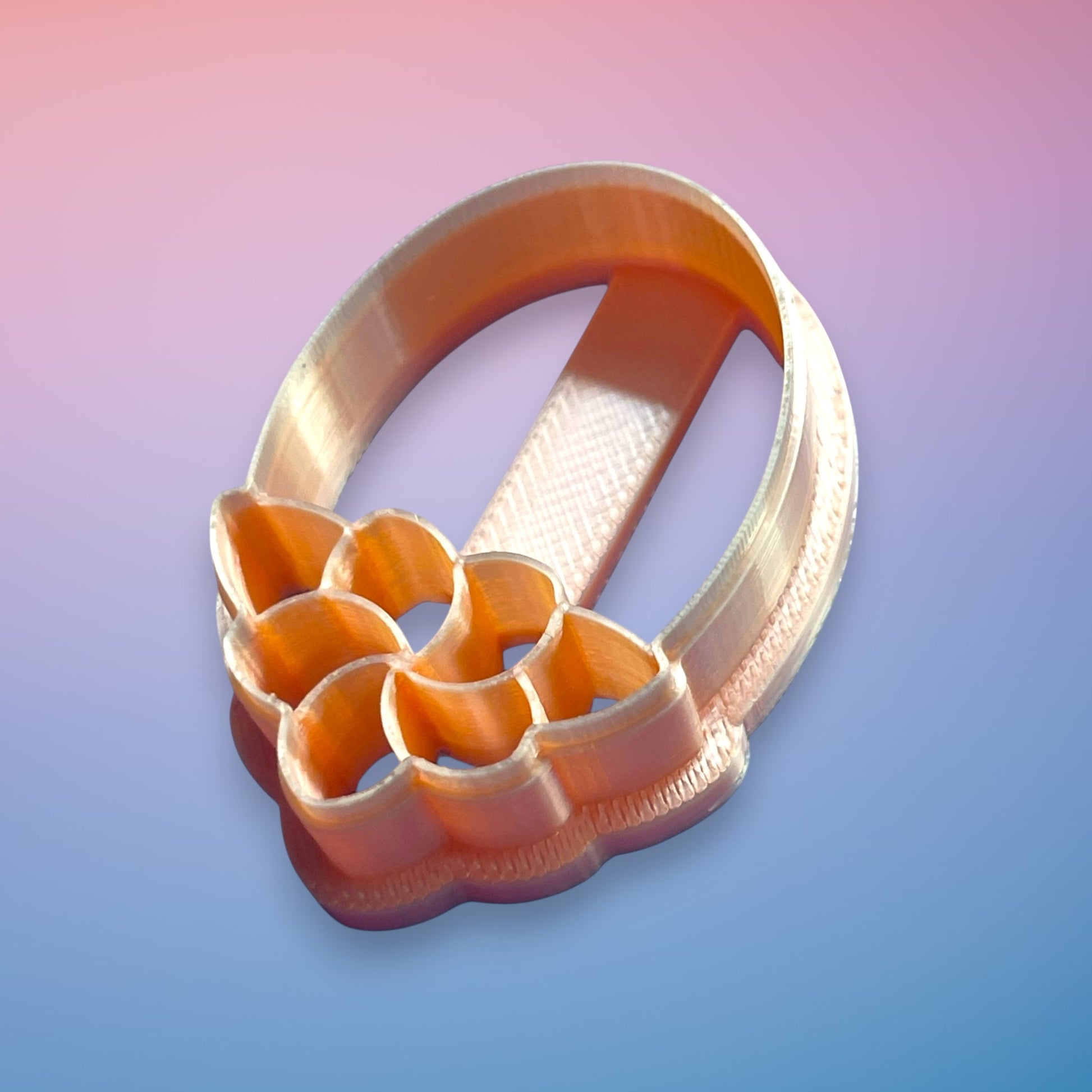 Deco Petal Drop polymer clay cutter with elongated Art Deco petal silhouette on white background.