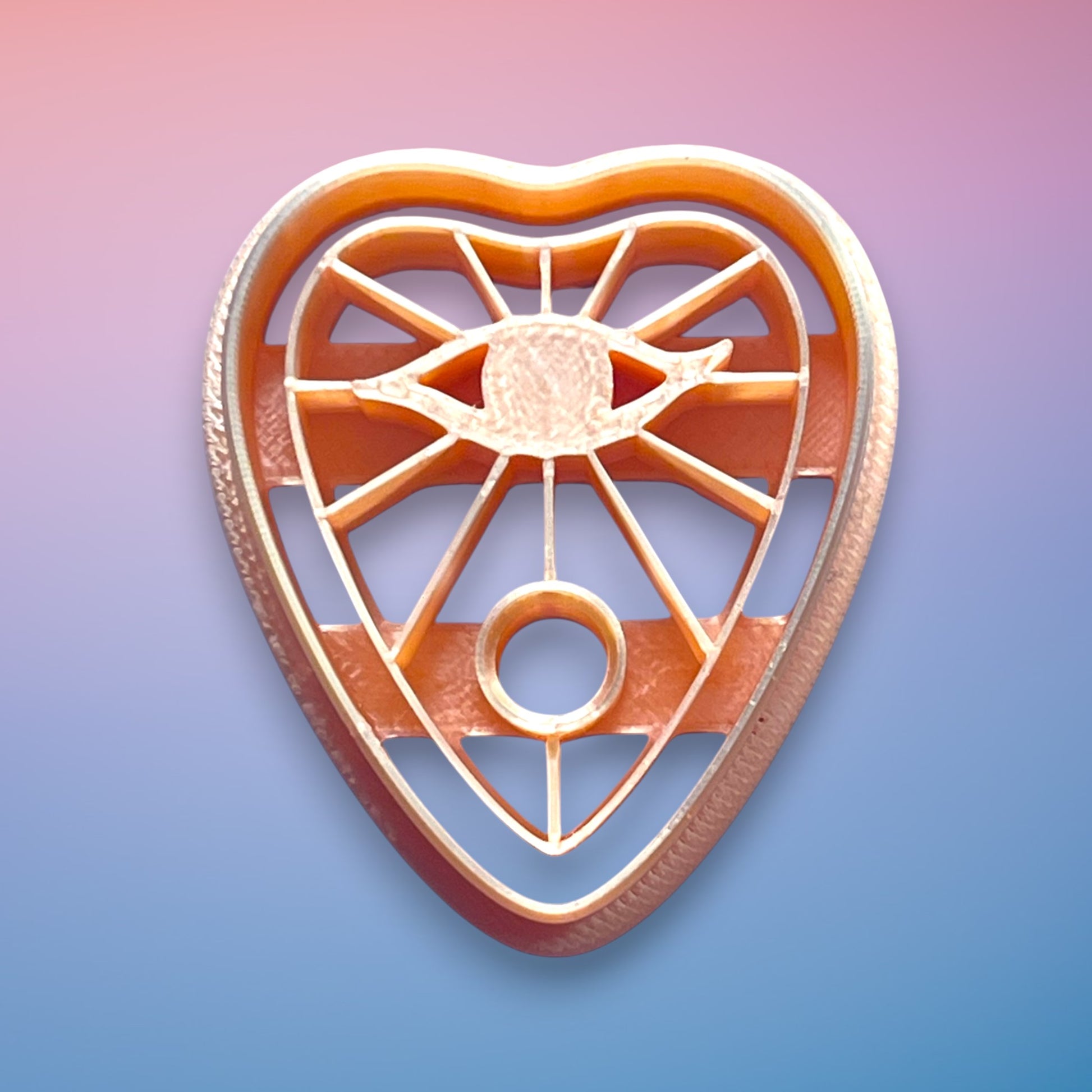 Eye Planchette Polymer Clay Cutter
Eye Planchette polymer clay cutter with mystical eye motif and radiant line detailing on white background.