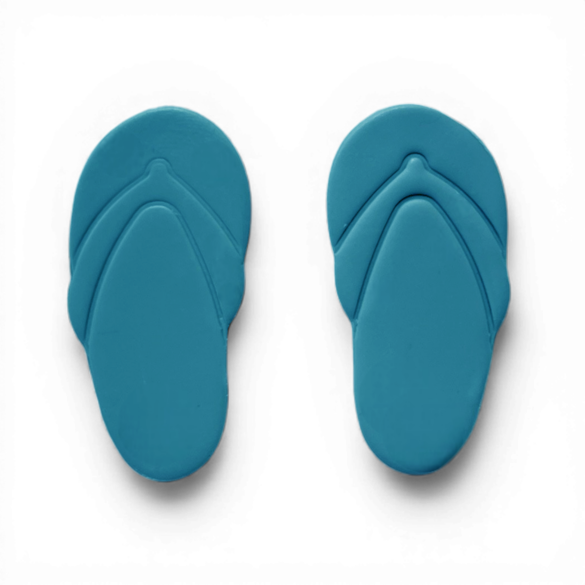 Blue polymer clay flip flops cutout for coastal jewelry designs.