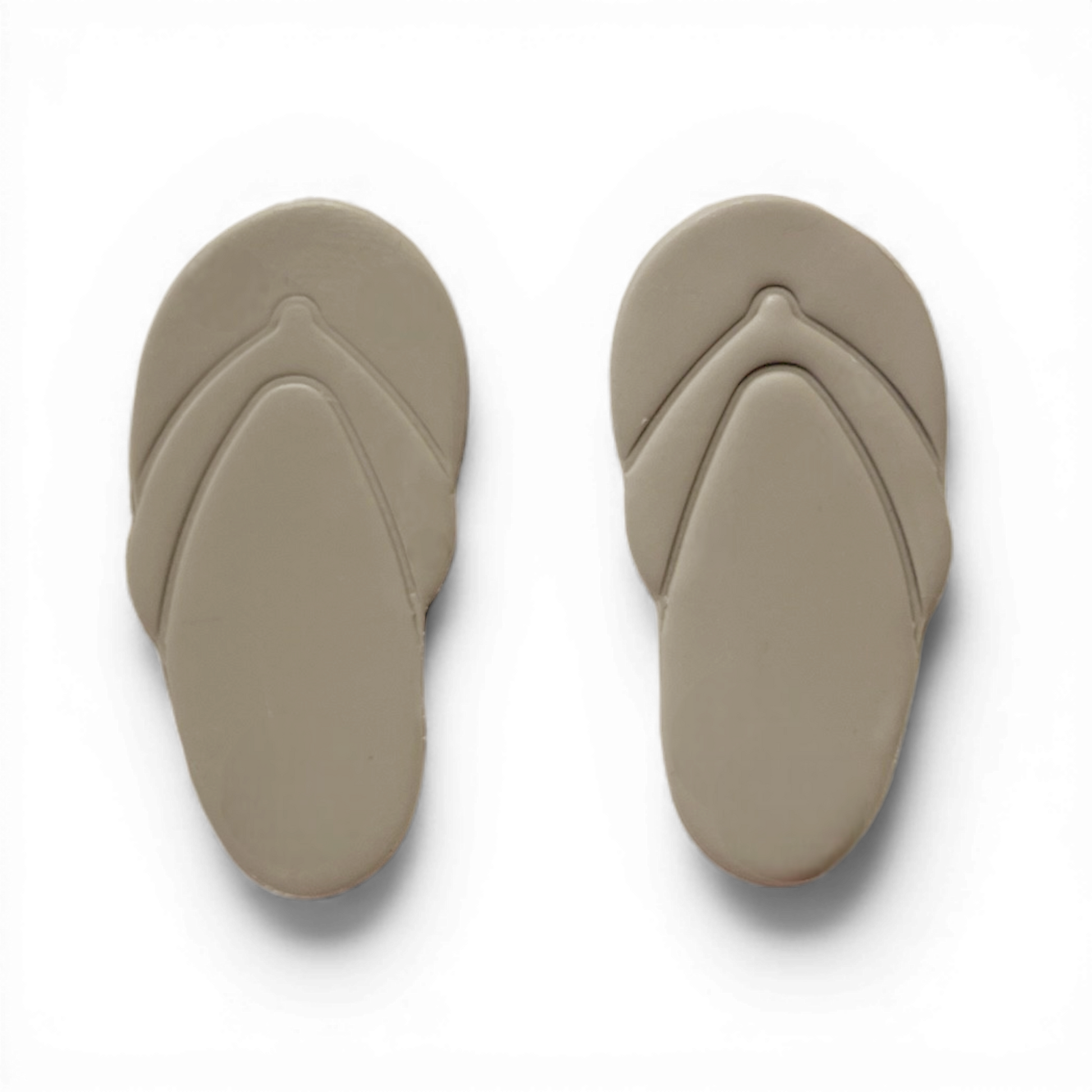 Taupe polymer clay flip flops cutout in neutral minimalist summer style.