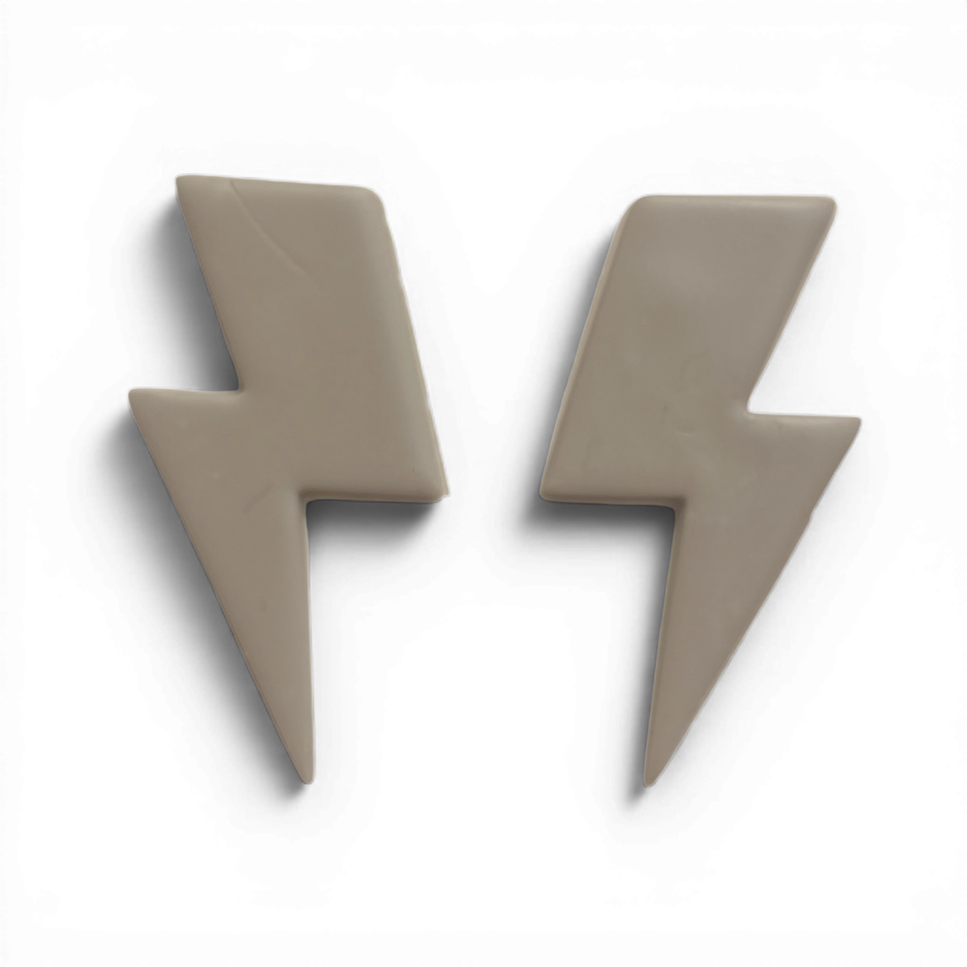 Lightening Bolt Polymer Clay Taupe
Lightening Bolt polymer clay shape in warm taupe with sharp lightning outline on white background.