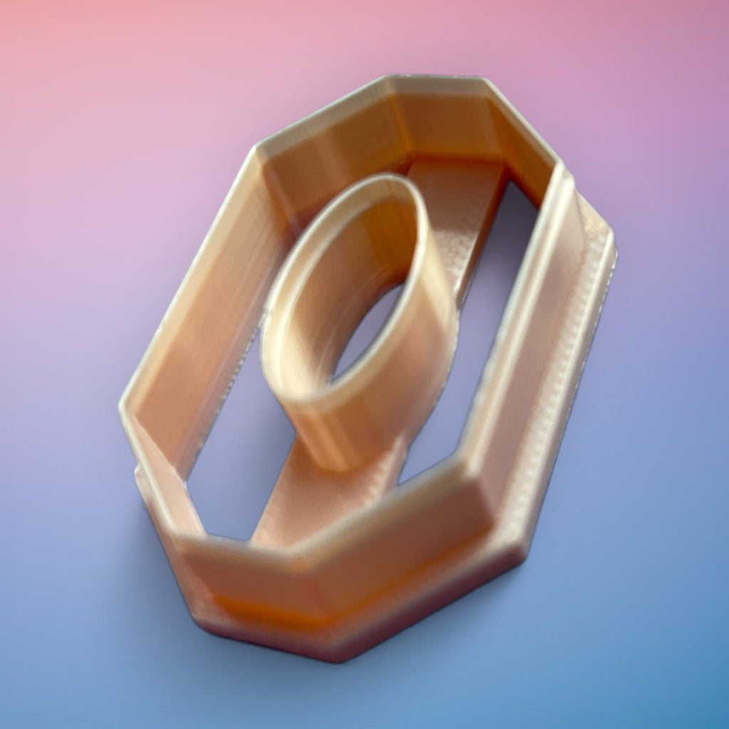 Long Octagon Oval Donut polymer clay cutter with elongated geometric open-frame shape on white background.