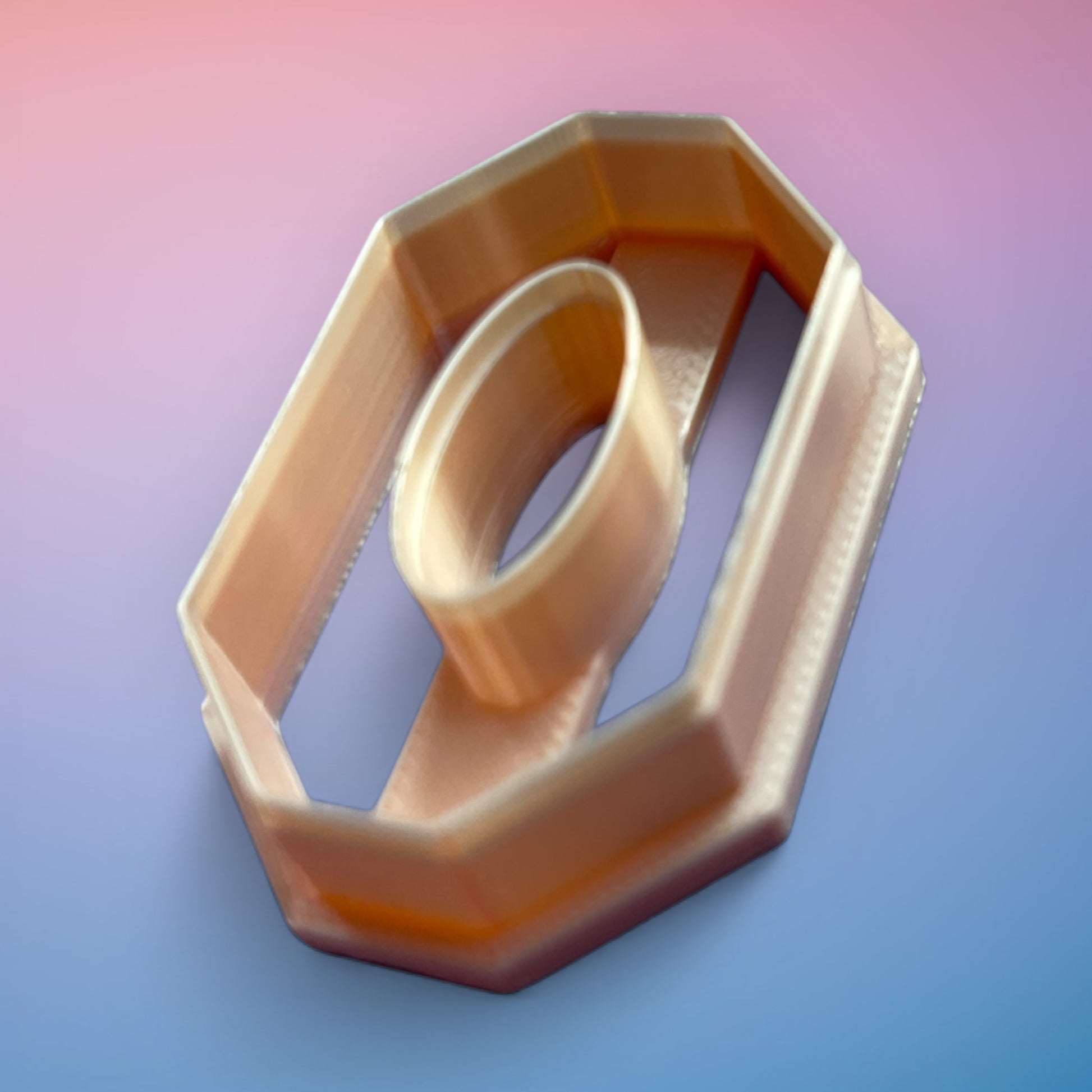Long Octagon Oval Donut polymer clay cutter with elongated geometric open-frame shape on white background.