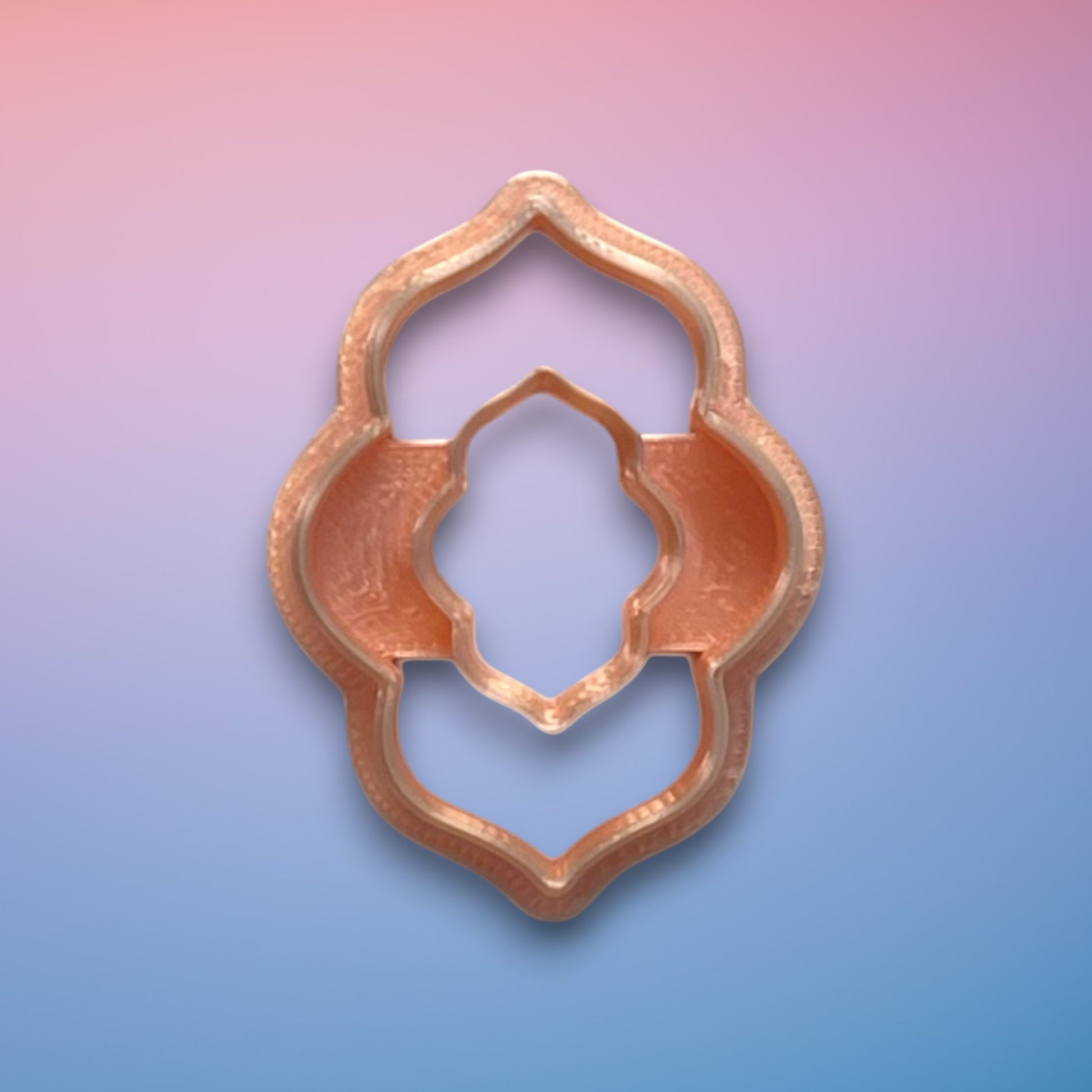 Moroccan Scalloped Donut polymer clay cutter with ornate scalloped circular open-frame on white background.