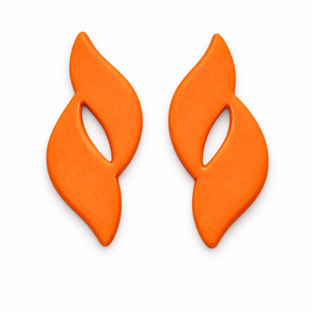 Flame Drop polymer clay cutters with clay cutouts in orange  white flat lay background