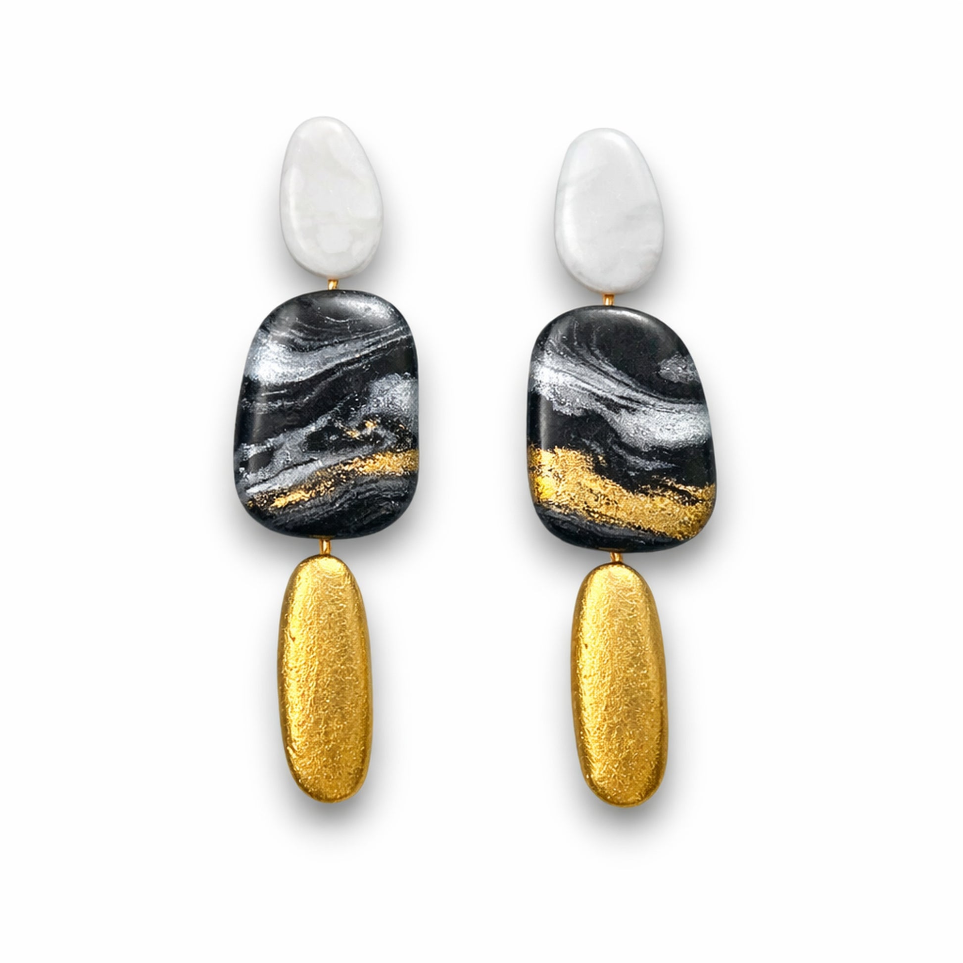 Pebble Stack polymer clay earrings featuring layered organic shapes in white, black, gold, and silver