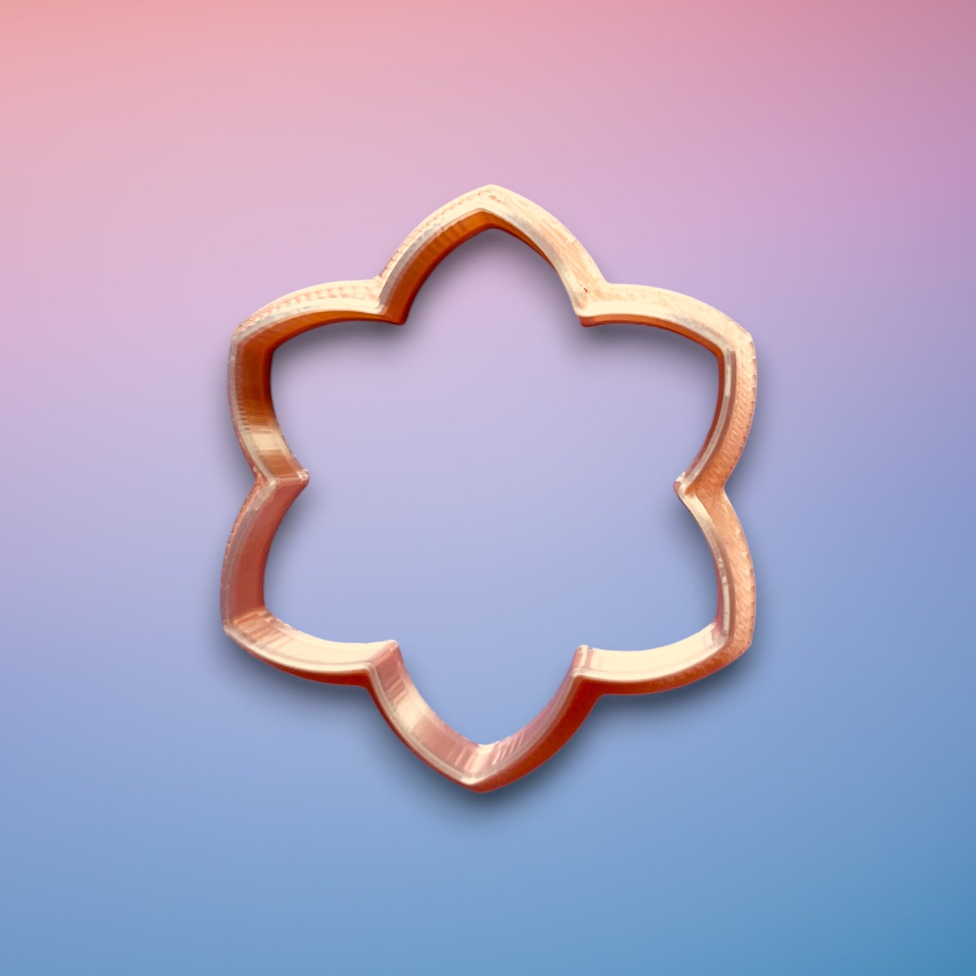 Petal Bloom Polymer Clay Cutter
Petal Bloom polymer clay cutter with layered floral silhouette on white background.