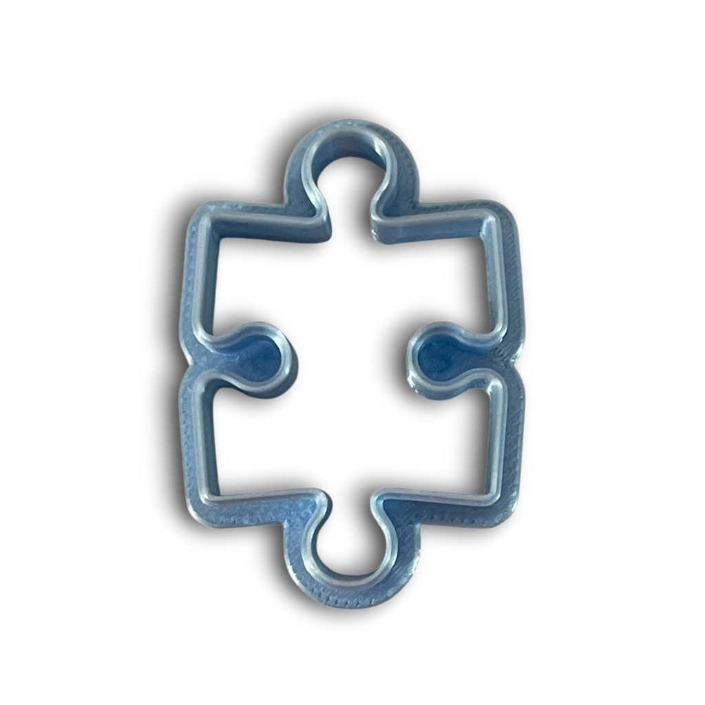 Puzzle piece polymer clay cutter with smooth rounded edges for earrings and pendants.