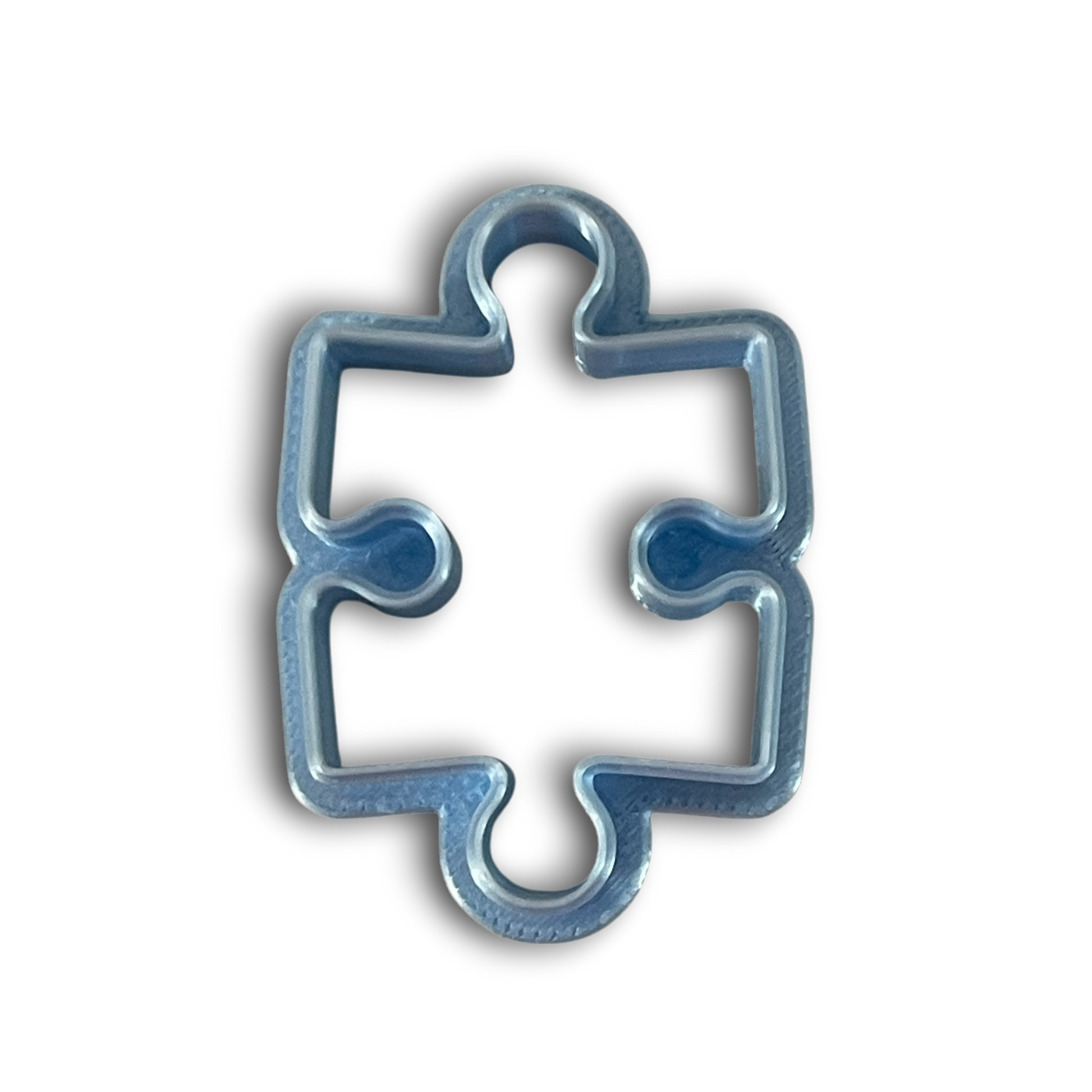 Puzzle piece polymer clay cutter with smooth rounded edges for earrings and pendants.