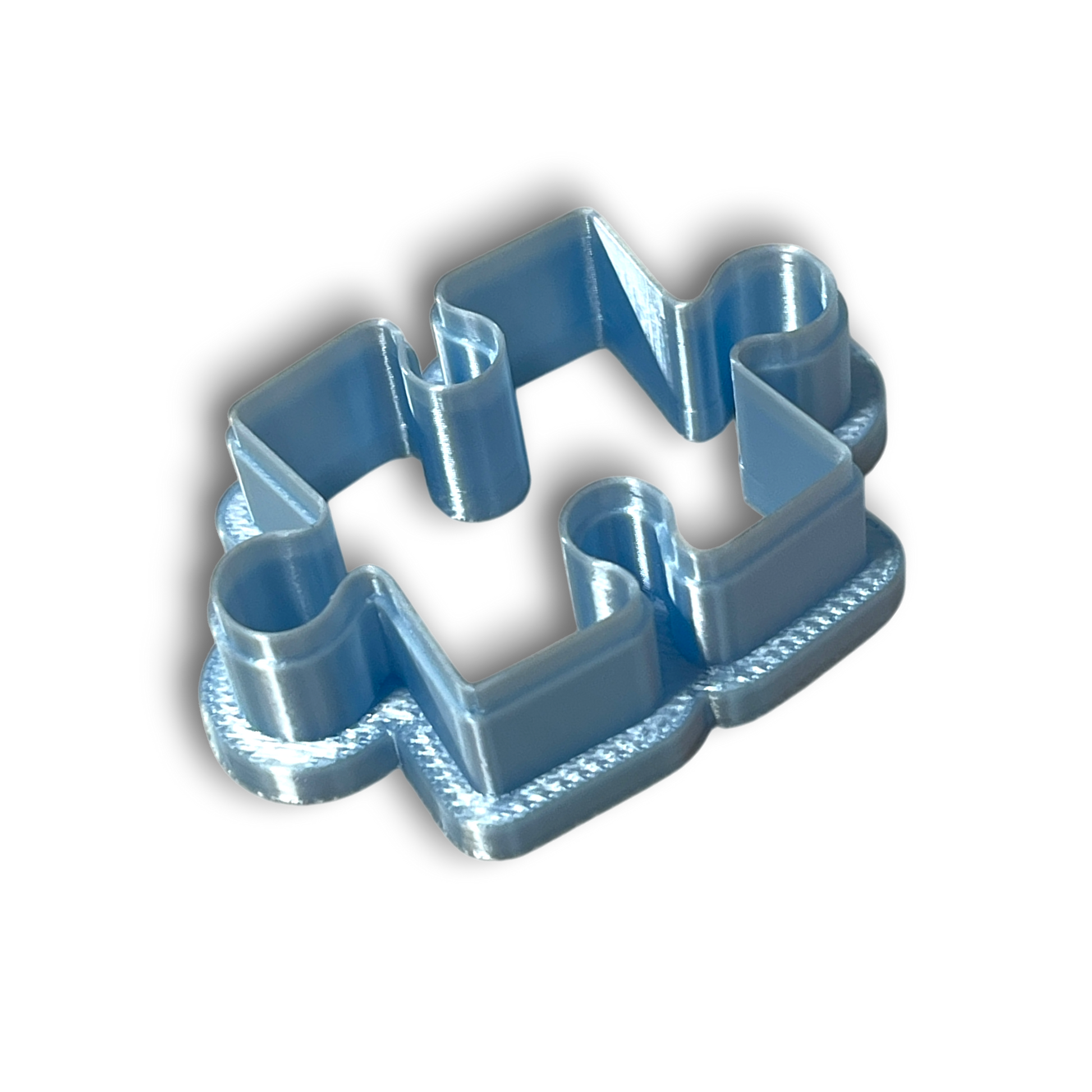 Puzzle piece polymer clay cutter with smooth rounded edges for earrings and pendants.
