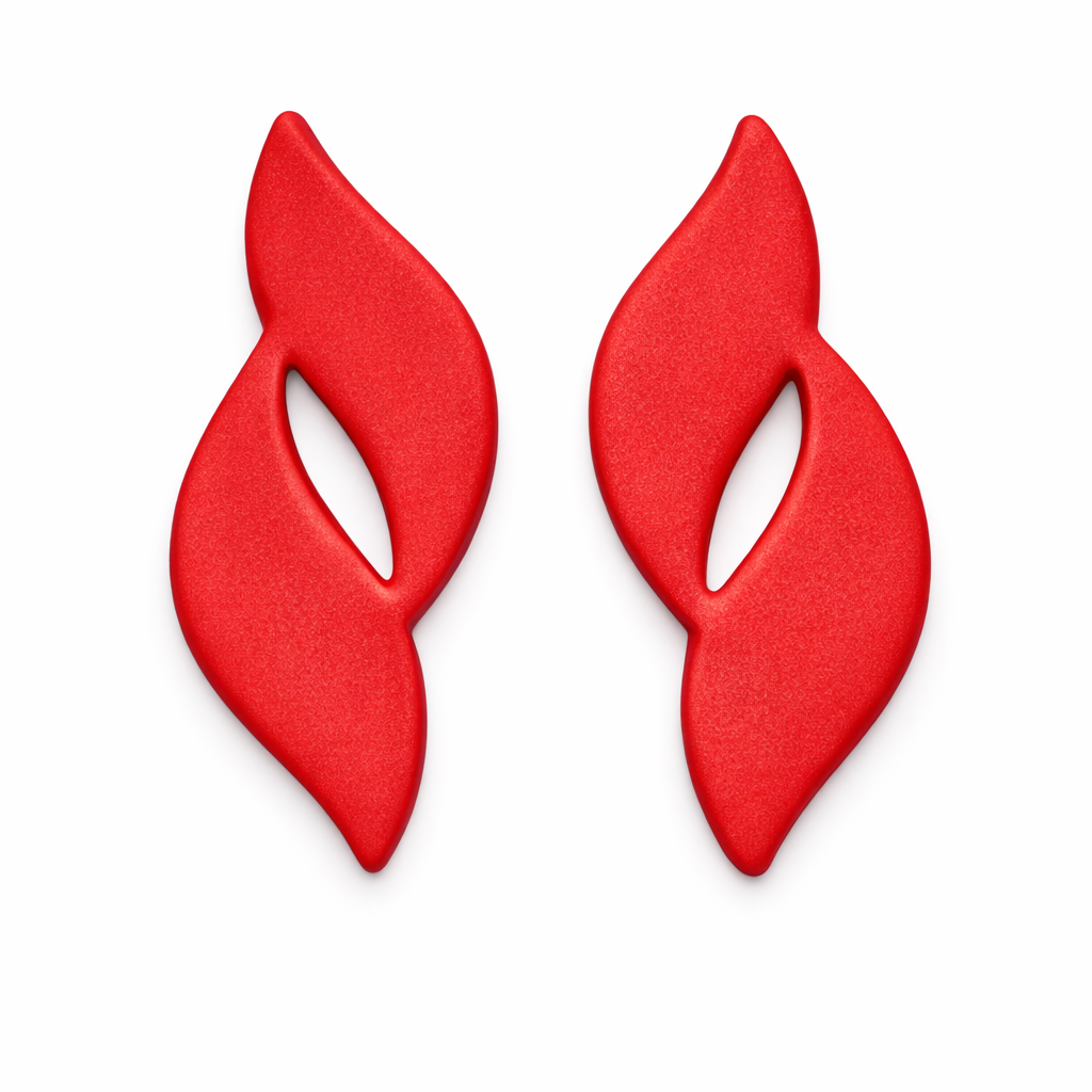 Flame Drop polymer clay cutters with clay cutouts in red, on white flat lay background