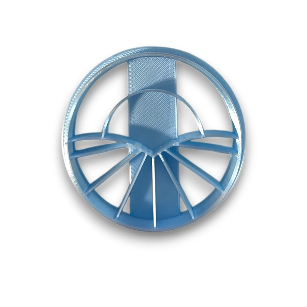 Round polymer clay cutter with rising sun and radiating ray design, geometric art deco style shape