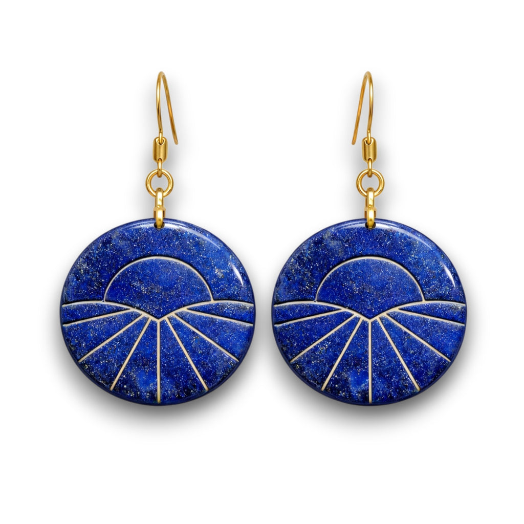 Pair of round polymer clay dangle earrings with faux lapis lazuli stone finish and rising sun design, featuring gold line detailing and gold-tone hooks