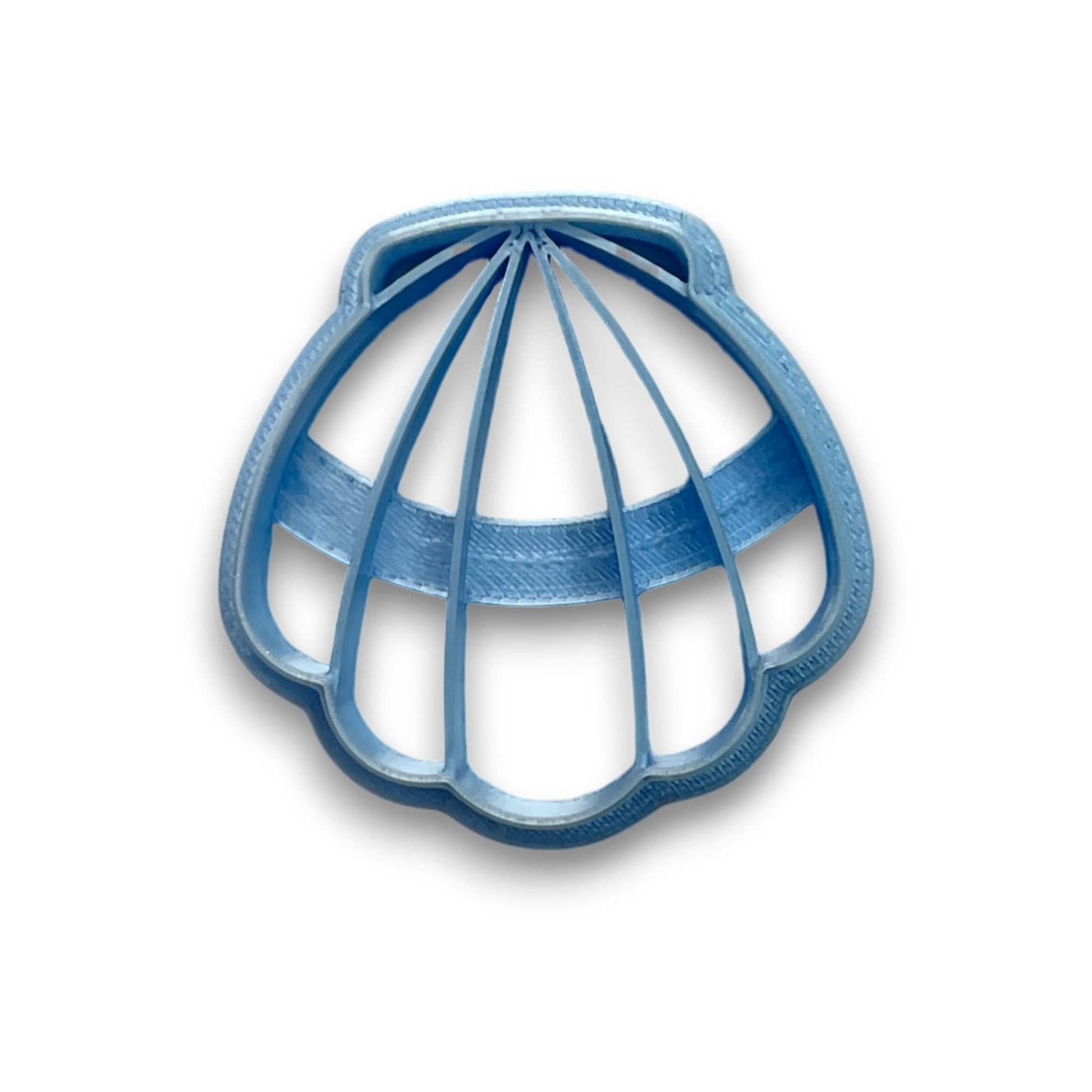 Scalloped shell–shaped polymer clay cutter for making ocean-inspired earrings and pendants, shown from top view.