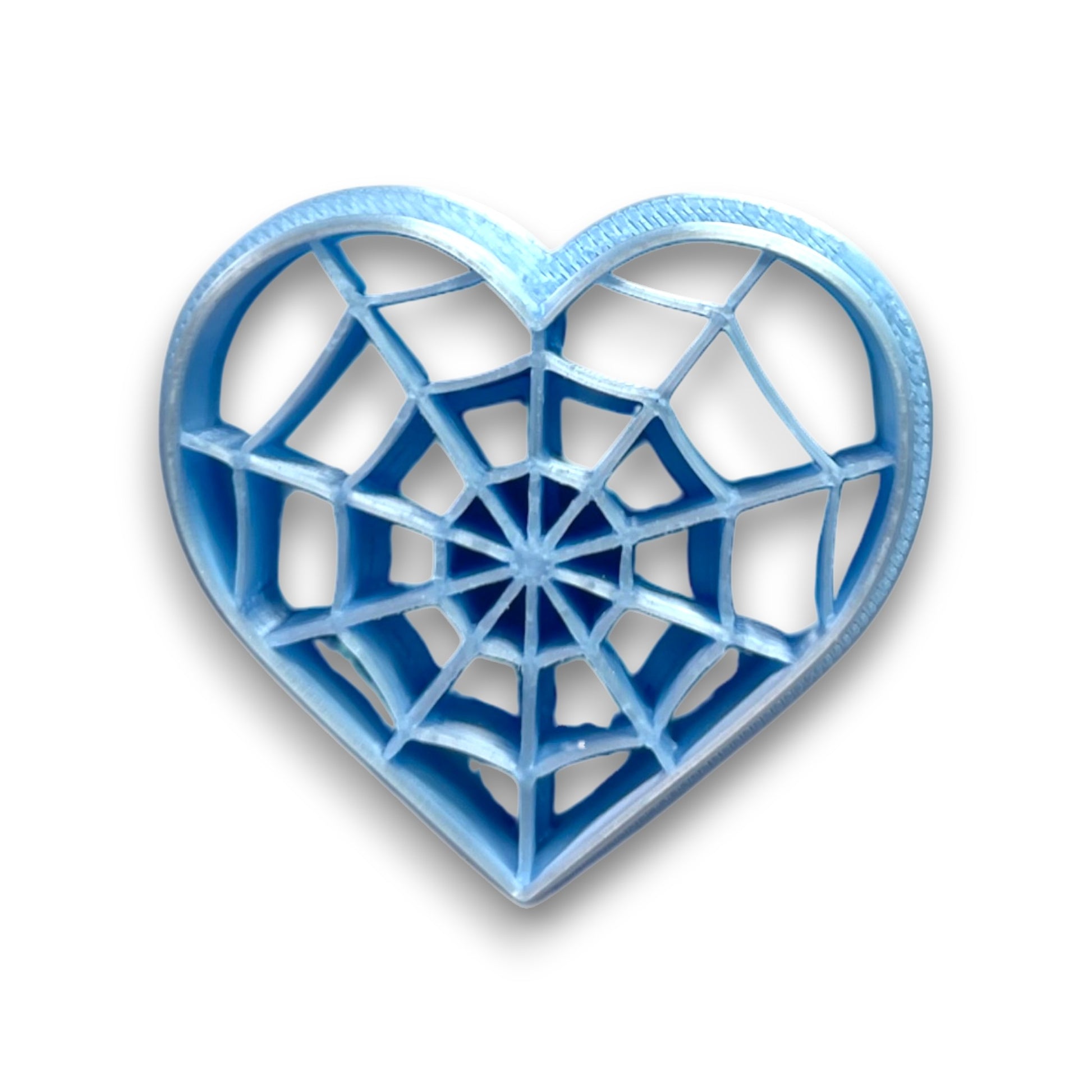 Webbed Heart polymer clay cutter with raised cobweb embossing, 3D printed clay tool on white background
