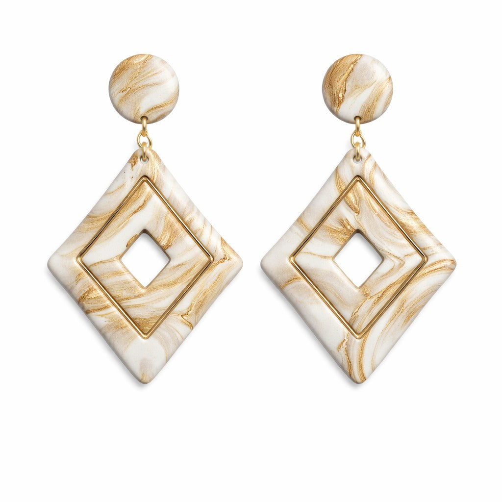White and gold diamond-shaped polymer clay drop earrings with a modern geometric design and smooth matte finish